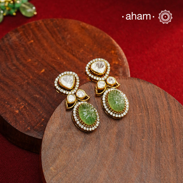 Expertly crafted earrings in 92.5% sterling silver with a refined gold polish finish, elegantly set with brilliant moissanite stones and green drop. Designed to offer lasting shine and sophistication making them a perfect choice for special occasions.
