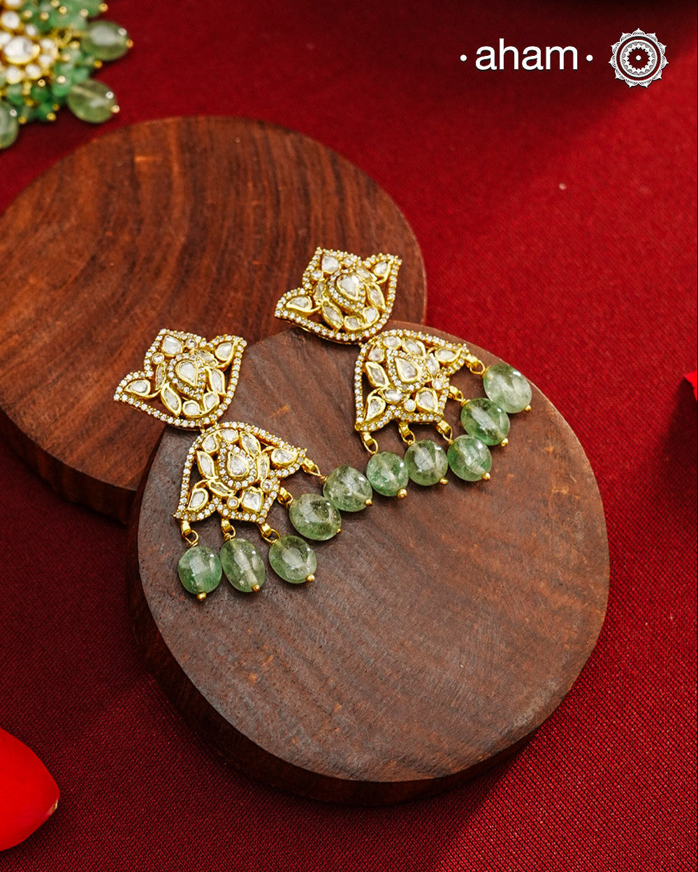 Expertly crafted earrings in 92.5% sterling silver with a refined gold polish finish and elegantly set with brilliant moissanite stones and green drops. Designed to offer lasting shine and sophistication making them a perfect choice for special occasions.