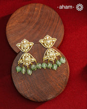 Expertly crafted earrings in 92.5% sterling silver with a refined gold polish finish and elegantly set with brilliant moissanite stones and green drops. Designed to offer lasting shine and sophistication making them a perfect choice for special occasions.&nbsp;