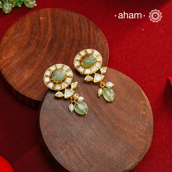 Expertly crafted earrings in 92.5% sterling silver with a refined gold polish finish, elegantly set with brilliant moissanite stones and green drops. Designed to offer lasting shine and sophistication making them a perfect choice for special occasions.