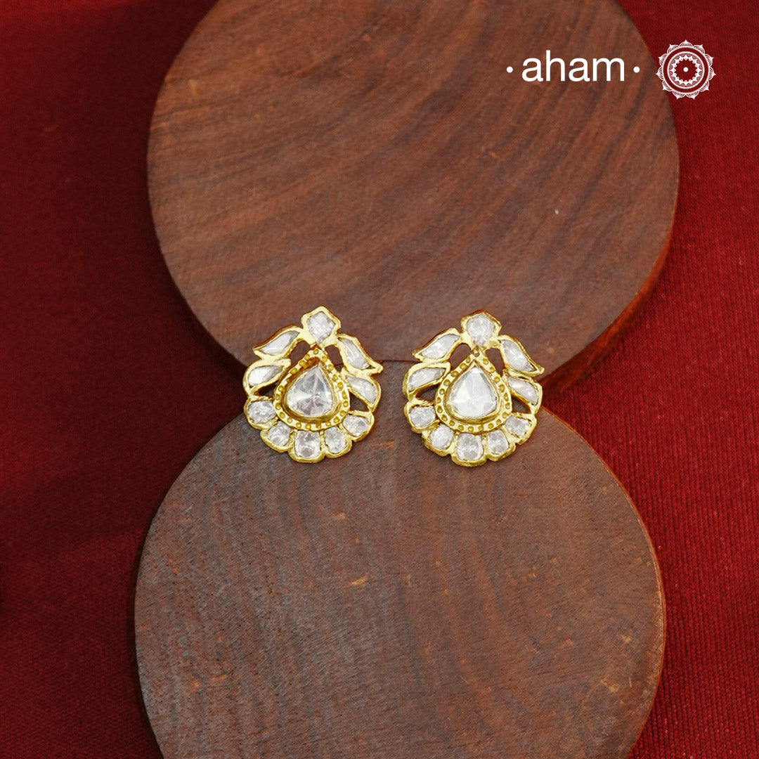 These expertly crafted studs feature 92.5% sterling silver with a refined gold polish finish, elegantly set with brilliant moissanite stones. Designed to offer lasting shine and sophistication making them a perfect choice for both everyday wear and special occasions. 