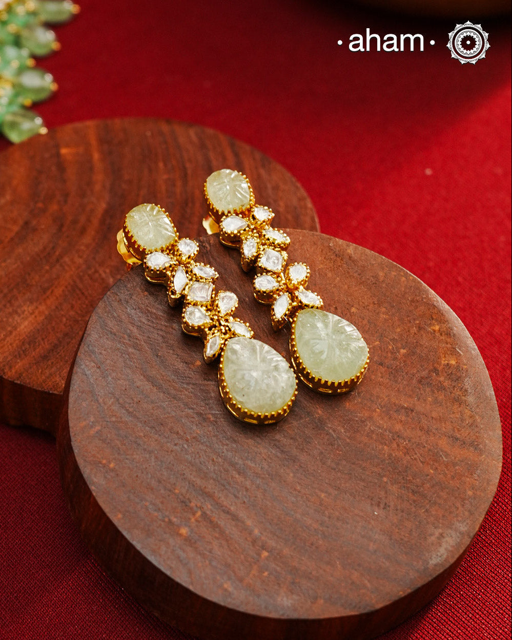 Expertly crafted earrings in 92.5% sterling silver with a refined gold polish finish and elegantly set with brilliant moissanite stones and green stone stud and drop. Designed to offer lasting shine and sophistication making them a perfect choice for special occasions. 