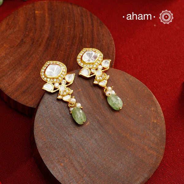 Expertly crafted earrings in 92.5% sterling silver with a refined gold polish finish, elegantly set with brilliant moissanite stones and a green drop. Designed to offer lasting shine and sophistication making them a perfect choice for special occasions.