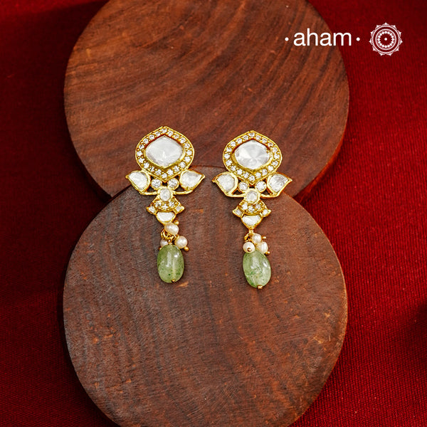 Expertly crafted earrings in 92.5% sterling silver with a refined gold polish finish, elegantly set with brilliant moissanite stones and a green drop. Designed to offer lasting shine and sophistication making them a perfect choice for special occasions.