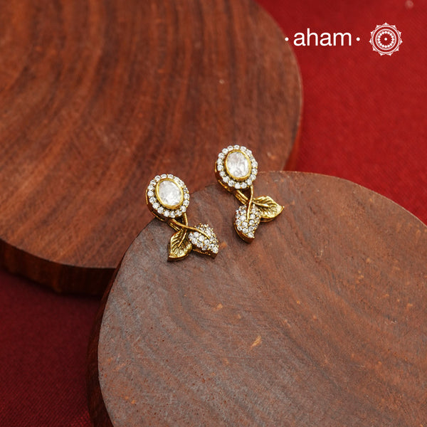 These expertly crafted studs feature 92.5% sterling silver with a fine gold polish finish and elegantly set with brilliant moissanite stones. Designed to offer lasting shine and sophistication making them a perfect choice for both everyday wear and special occasions.