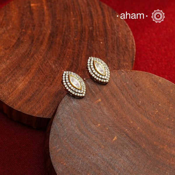 These expertly crafted studs feature 92.5% sterling silver with a refined gold polish finish, elegantly set with brilliant moissanite stones. Designed to offer lasting shine and sophistication making them a perfect choice for both everyday wear and special occasions.
