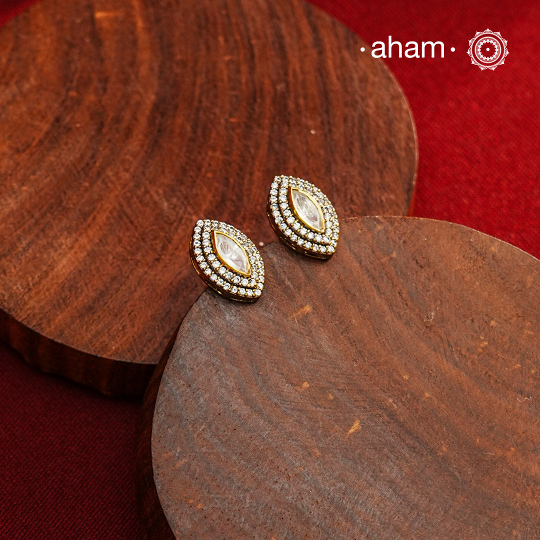 These expertly crafted studs feature 92.5% sterling silver with a refined gold polish finish, elegantly set with brilliant moissanite stones. Designed to offer lasting shine and sophistication making them a perfect choice for both everyday wear and special occasions.