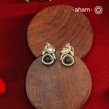 These expertly crafted studs feature 92.5% sterling silver with a fine gold polish finish, elegantly set with brilliant moissanite stones and a lustrous deep purple stone drop. Designed to offer lasting shine and sophistication making them a perfect choice for both everyday wear and special occasions.  
