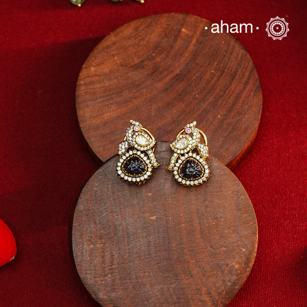 These expertly crafted studs feature 92.5% sterling silver with a fine gold polish finish, elegantly set with brilliant moissanite stones and a lustrous deep purple stone drop. Designed to offer lasting shine and sophistication making them a perfect choice for both everyday wear and special occasions.  