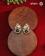 These expertly crafted studs feature 92.5% sterling silver with a fine gold polish finish, elegantly set with brilliant moissanite stones and a lustrous deep purple stone drop. Designed to offer lasting shine and sophistication making them a perfect choice for both everyday wear and special occasions. 