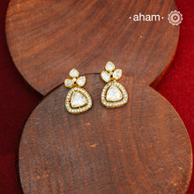 These expertly crafted studs feature 92.5% sterling silver with a refined gold polish finish, elegantly set with brilliant moissanite stones. Designed to offer lasting shine and sophistication making them a perfect choice for both everyday wear and special occasions. 