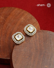 These expertly crafted studs feature 92.5% sterling silver with a fine gold polish finish, elegantly set with brilliant moissanite stones and a lustrous green stone in the center. Designed to offer lasting shine and sophistication making them a perfect choice for both everyday wear and special occasions.