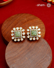 Expertly crafted studs in 92.5% sterling silver with a fine gold polish finish, elegantly set with brilliant moissanite stones and a lustrous green stone in the center. Designed to offer lasting shine and sophistication making them a perfect choice for special occasions.