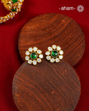 These expertly crafted studs feature 92.5% sterling silver with a fine gold polish finish, elegantly set with brilliant moissanite stones and a lustrous green stone in the center. Designed to offer lasting shine and sophistication making them a perfect choice for both everyday wear and special occasions.