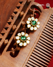 These expertly crafted studs feature 92.5% sterling silver with a fine gold polish finish, elegantly set with brilliant moissanite stones and a lustrous green stone in the center. Designed to offer lasting shine and sophistication making them a perfect choice for both everyday wear and special occasions.