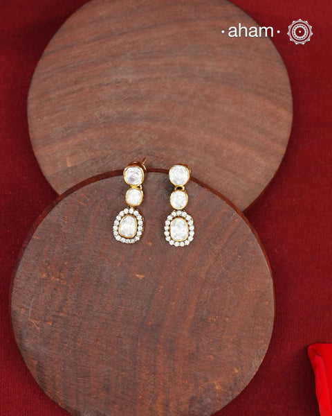 These expertly crafted studs feature 92.5% sterling silver with a fine gold polish finish, elegantly set with brilliant moissanite stones. Designed to offer lasting shine and sophistication making them a perfect choice for both everyday wear and special occasions.