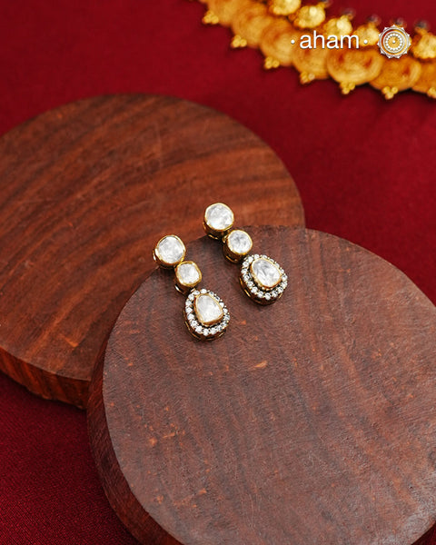 These expertly crafted studs feature 92.5% sterling silver with a fine gold polish finish, elegantly set with brilliant moissanite stones. Designed to offer lasting shine and sophistication making them a perfect choice for both everyday wear and special occasions.