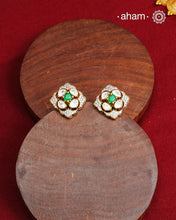 These expertly crafted studs feature 92.5% sterling silver with a fine gold polish finish, elegantly set with brilliant moissanite stones and a lustrous green stone in the center. Designed to offer lasting shine and sophistication making them a perfect choice for both everyday wear and special occasions.  