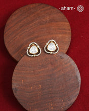 These expertly crafted studs feature 92.5% sterling silver with a fine gold polish finish, elegantly set with brilliant moissanite stones.  Designed to offer lasting shine and sophistication making them a perfect choice for both everyday wear and special occasions