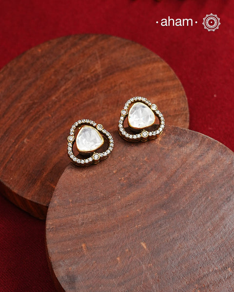 These expertly crafted studs feature 92.5% sterling silver with a fine gold polish finish, elegantly set with brilliant moissanite stones.  Designed to offer lasting shine and sophistication making them a perfect choice for both everyday wear and special occasions