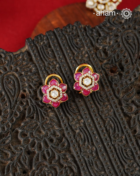 Expertly crafted studs in 92.5% sterling silver with a fine gold polish finish, elegantly set with brilliant moissanite stones and a lustrous pink stones. Designed to offer lasting shine and sophistication making them a perfect choice for special occasions.