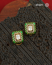 Expertly crafted studs in 92.5% sterling silver with a fine gold polish finish, elegantly set with brilliant moissanite stone in the center and lustrous Green meena work around it. Designed to offer lasting shine and sophistication making them a perfect choice for special occasions.