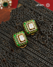 Expertly crafted studs in 92.5% sterling silver with a fine gold polish finish, elegantly set with brilliant moissanite stone in the center and lustrous Green meena work around it. Designed to offer lasting shine and sophistication making them a perfect choice for special occasions.