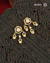 A classic silhouette elevated with exquisite detailing, these earrings are handcrafted in 92.5 sterling silver, finished with a radiant gold polish and set with brilliant moissanite stones. Perfect for effortless day-to-evening styling, they bring understated elegance to every look.