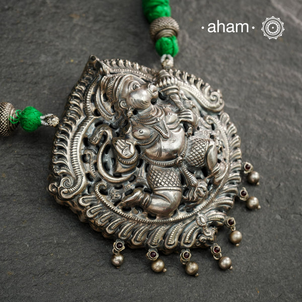 Statement Hanumanji Pendant in 92.5 sterling silver with cotton adjustable thread. Intricate Nakshi/ Naksahi work 3 d Idols, inspired from South Indian temple work. Created using Repoussé and chasing technique