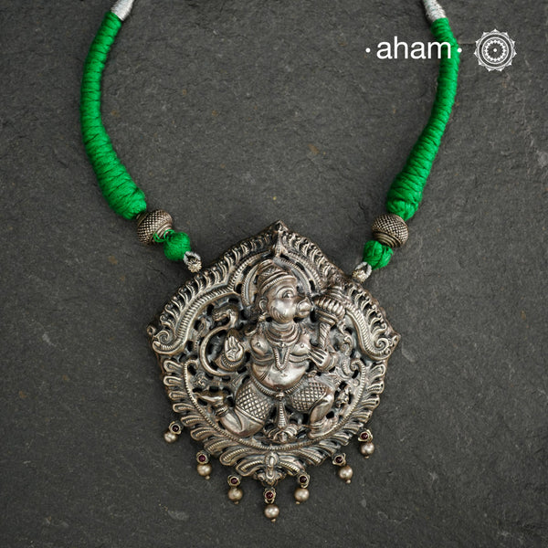 Statement Hanumanji Pendant in 92.5 sterling silver with cotton adjustable thread. Intricate Nakshi/ Naksahi work 3 d Idols, inspired from South Indian temple work. Created using Repoussé and chasing technique