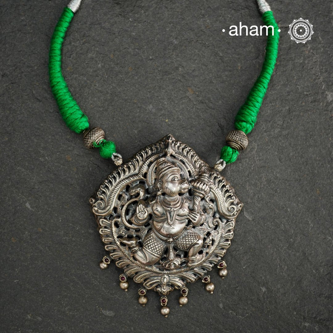 Statement Hanumanji Pendant in 92.5 sterling silver with cotton adjustable thread. Intricate Nakshi/ Naksahi work 3 d Idols, inspired from South Indian temple work. Created using Repoussé and chasing technique
