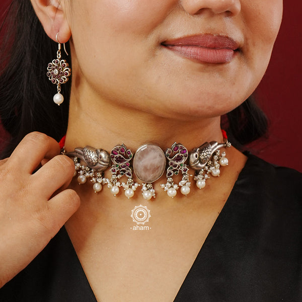 Handcrafted 92.5 silver choker with beautiful silver parrots, kemp studded peacocks, a pink rose coloured stone in the center and laced with beautiful pearls.  (Please note the earring is not part of the purchase, Price is only for the choker)