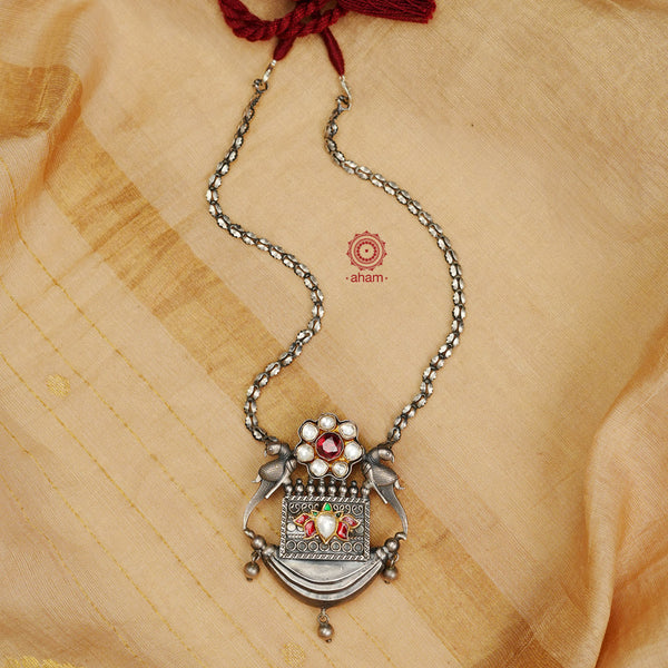 Silver Neckpiece with a stunning pendant that has two perfect parrots perched on wither sides and embelished with kundan flowers. Crafted in 92.5 silver Looks Fabulous with a Kurta or Sari. 