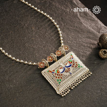 Crafted with traditional Rajasthani artistry, this Mewad Silver Peacock Neckpiece showcases exquisite meenawork and intricate peacock motifs. Each piece reflects centuries of heritage craftsmanship, making it an exceptional choice for connoisseurs of traditional jewelry. The authentic techniques employed create a statement piece that honours India's rich silversmithing legacy.