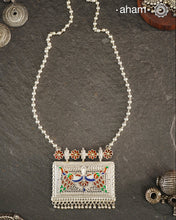 Crafted with traditional Rajasthani artistry, this Mewad Silver Peacock Neckpiece showcases exquisite meenawork and intricate peacock motifs. Each piece reflects centuries of heritage craftsmanship, making it an exceptional choice for connoisseurs of traditional jewelry. The authentic techniques employed create a statement piece that honours India's rich silversmithing legacy.