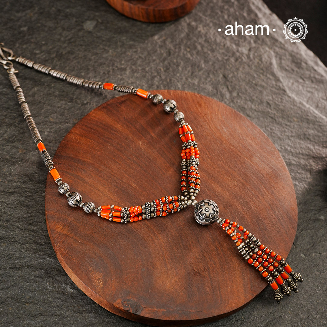 Handcrafted Mewad silver neckpiece with silver and coral beads. Sits close to the neck.