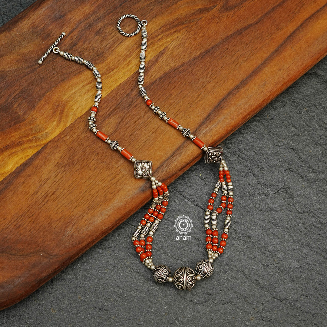 This gorgeous Coral Bead and Silver Neckpiece adds a touch of elegance to any outfit. Perfectly handcrafted and featuring beautiful silver beads, it's perfect for any occasion, from the office to date night. Wear and experience the luxury of Coral Bead and Silver Neckpiece.