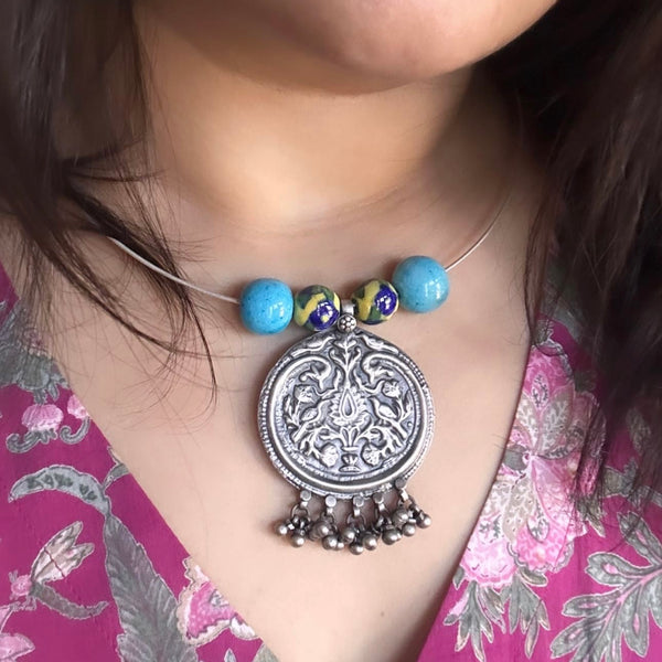Everyday Wear Silver Chitai Pendant in 92.5 silver and Jaipur Blue Pottery Beads in Wire Hasli.  Easy to wear, looks great with Indian and Western outfits.  The Hasli is easily removable and can be used with any other pendant as well. 