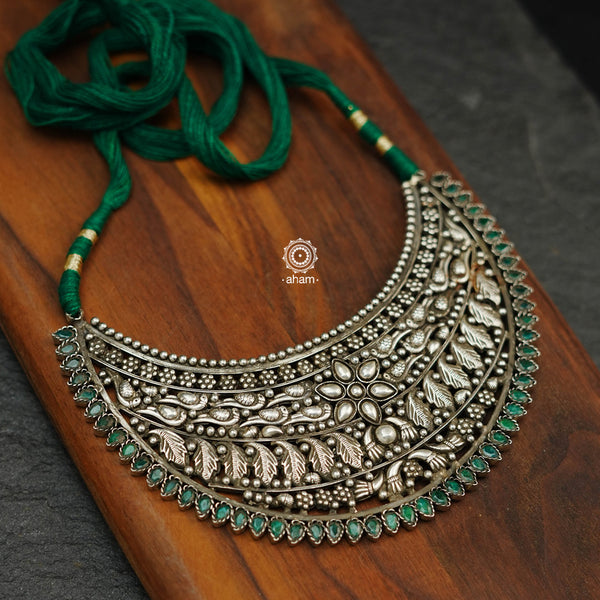 Look chic and stand out from the crowd with the Mewad Silver Neckpiece. Crafted with 92.5 silver, this intricately detailed necklace features elegant green stone highlights for a sophisticated look. Wear it around your neck or let it hang a little longer for a unique, stylish touch.