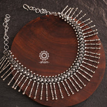 This Mewad Silver Neckpiece is crafted with 92.5 silver and is the perfect addition to your Navratri wardrobe. It can be worn alone or layered, making it a versatile and stylish accessory for any occasion.