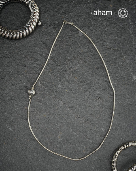 Handcrafted 92.5 sterling silver chain with a small meena bead on one side.Simple designs that add some much value to your everyday dressing.