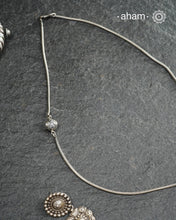 Handcrafted 92.5 sterling silver chain with a small meena bead on one side.Simple designs that add some much value to your everyday dressing.