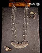 The Mewad Silver Neckpiece is a captivating accessory featuring a boat-shaped amulet delicately adorned with tiny pearls. Crafted from 92.5% pure silver, its side chains are embellished with elegant vintage-style flowers. This statement piece blends classic charm with subtle sophistication, making it the perfect addition to elevate your style effortlessly.