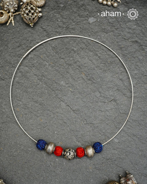 Everyday Wear Silver neckpiece in 92.5 silver in Wire Hasli and three beautiful silver balls interspersed with bright cotton balls. Easy to wear, looks great with Indian and Western outfits. The Hasli is easily removable and can be used with any other pendant as well.