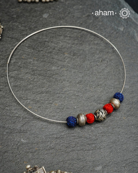 Everyday Wear Silver neckpiece in 92.5 silver in Wire Hasli and three beautiful silver balls interspersed with bright cotton balls. Easy to wear, looks great with Indian and Western outfits. The Hasli is easily removable and can be used with any other pendant as well.