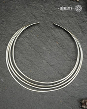 Discover understated luxury with this four-line silver hasli, a masterfully crafted collar piece in 92.5 sterling silver. Its clean, geometric design bridges the gap between casual and formal wear—pair it effortlessly with your favourite shirt or dress. The versatile open framework welcomes customization; add a pendant to create a signature look or wear it bare for refined minimalism. Handcrafted with precision, this piece embodies timeless elegance and adaptability for the discerning jewellery