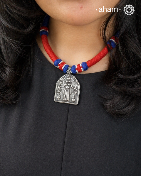 Discover the charm of traditional craftsmanship with our Handmade Karni Mata in 92.5 Sterling Silver Pendan on a beautiful cotton cord.&nbsp;

Expertly crafted using the thapi (stamp die) technique, this pendant reflects the age-old artistry of India’s tribal communities. Known by various names like Kavach, Mandaliya, Patri, and Kathla, amulet pendants have long been cherished as symbols of passive worship—a way to keep your deity, Kuldevta, or Kuldevi close to your heart. Traditionally worn on a cord or si