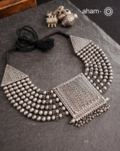 This expert-crafted Mewad Silver Neckpiece features a striking central pendant flanked by side triangles, all detailed with fine tar work. Its bold design makes it an exceptional statement piece, perfect for elevating any outfit with a touch of traditional artistry and refined craftsmanship.