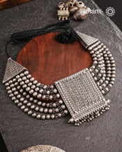This expert-crafted Mewad Silver Neckpiece features a striking central pendant flanked by side triangles, all detailed with fine tar work. Its bold design makes it an exceptional statement piece, perfect for elevating any outfit with a touch of traditional artistry and refined craftsmanship.