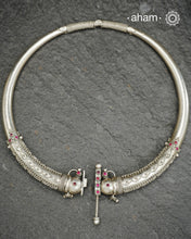 Mewad Silver Hasli crafted in 92.5 sterling silver, featuring exquisite rava and tar work that showcases traditional artisanal techniques. This reversible piece displays identical intricate detailing on both sides, allowing you to wear it according to your preference. The meticulous handwork reflects the heritage of Mewad craftsmanship, making it a versatile addition to your jewellery collection that transitions seamlessly between occasions.